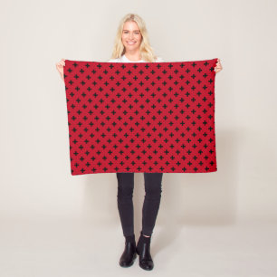 Black polka crosses on red fleece blanket