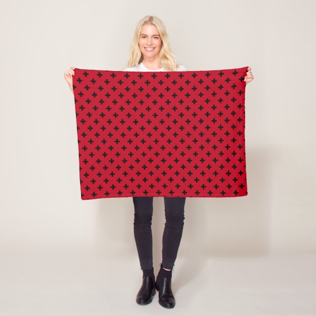 Black polka crosses on red fleece blanket (In Situ)