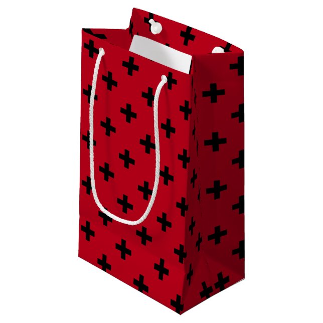 Black polka crosses on red small gift bag (Front Angled)