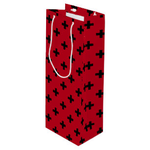 Black polka crosses on red wine gift bag