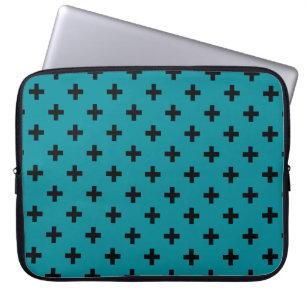 Black polka crosses on teal laptop sleeve
