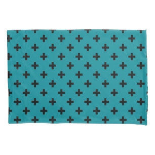 Black polka crosses on teal pillowcase