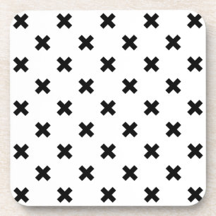 Black polka crosses on white coaster