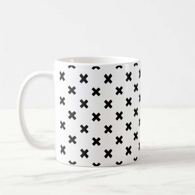 Black polka crosses on white coffee mug (Left)