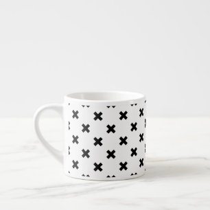 Black polka crosses on white espresso cup
