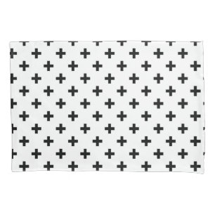 Black polka crosses on white pillowcase