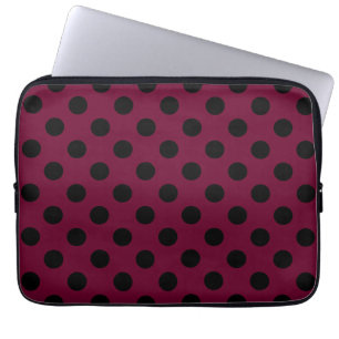 Black polka dots on burgundy laptop sleeve