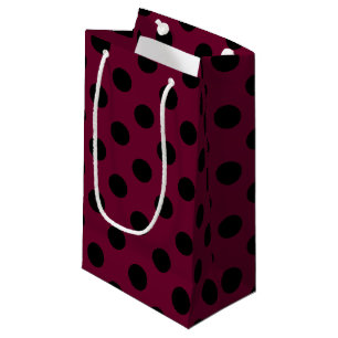 Black polka dots on burgundy small gift bag