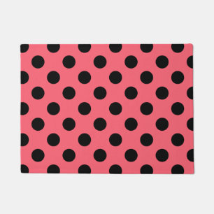 Black polka dots on coral doormat