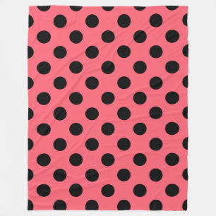 Black polka dots on coral fleece blanket