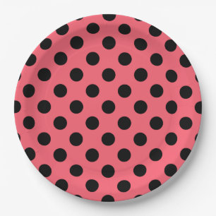 Black polka dots on coral paper plate