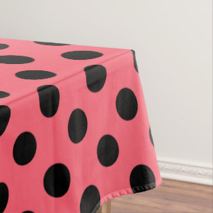 Black polka dots on coral tablecloth