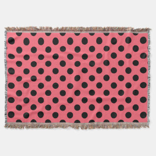 Black polka dots on coral throw blanket