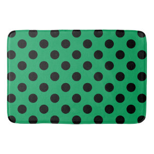 Black polka dots on fresh green bath mat