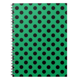 Black polka dots on fresh green notebook