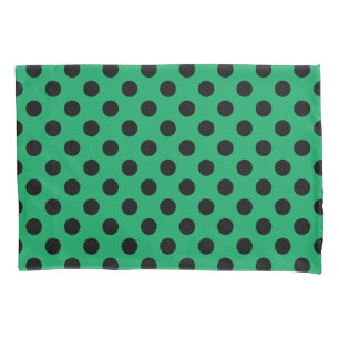Black polka dots on fresh green pillowcase