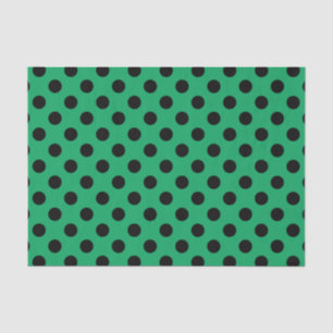 Black polka dots on fresh green tissue paper