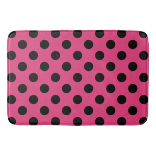 Black polka dots on fuchsia bath mat