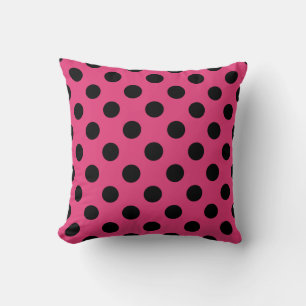 Black polka dots on fuchsia cushion