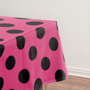 Black polka dots on fuchsia tablecloth