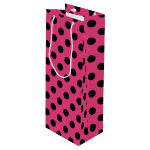 Black polka dots on fuchsia wine gift bag