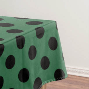 Black polka dots on kelly green tablecloth