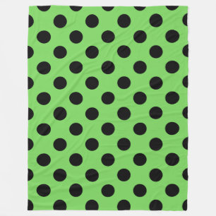 Black polka dots on lime green fleece blanket