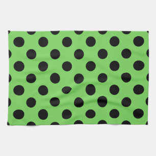 Black polka dots on lime green tea towel