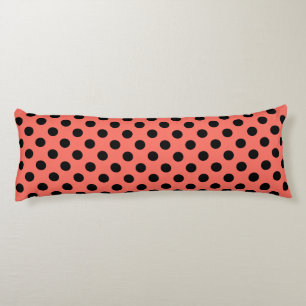 Black polka dots on living coral body cushion