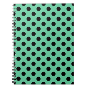 Black polka dots on mint green notebook