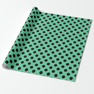Black polka dots on mint green wrapping paper