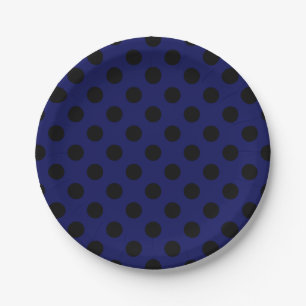 Black polka dots on navy blue paper plate