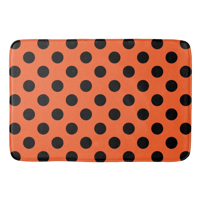 Black polka dots on orange bath mat (Front)