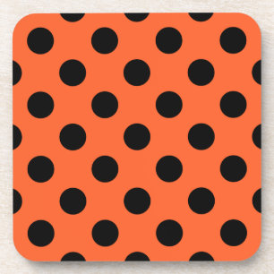 Black polka dots on orange coaster