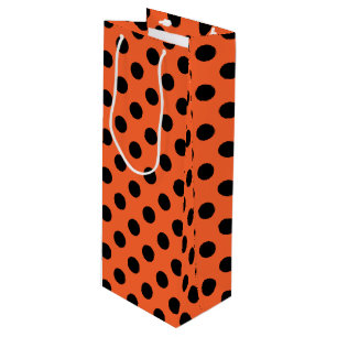 Black polka dots on orange wine gift bag