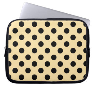 Black polka dots on pale yellow laptop sleeve