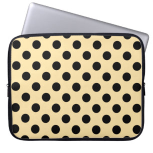 Black polka dots on pale yellow laptop sleeve