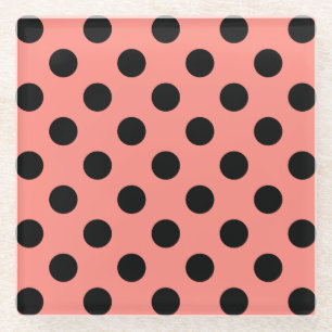 Black polka dots on peach glass coaster