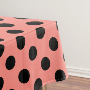 Black polka dots on peach tablecloth