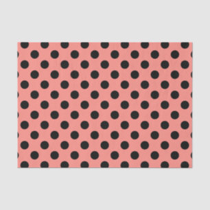 Black polka dots on peach tissue paper