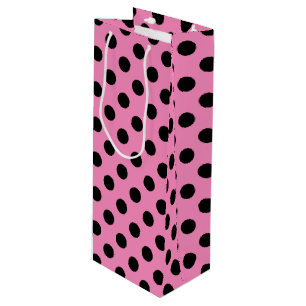Black polka dots on pink wine gift bag