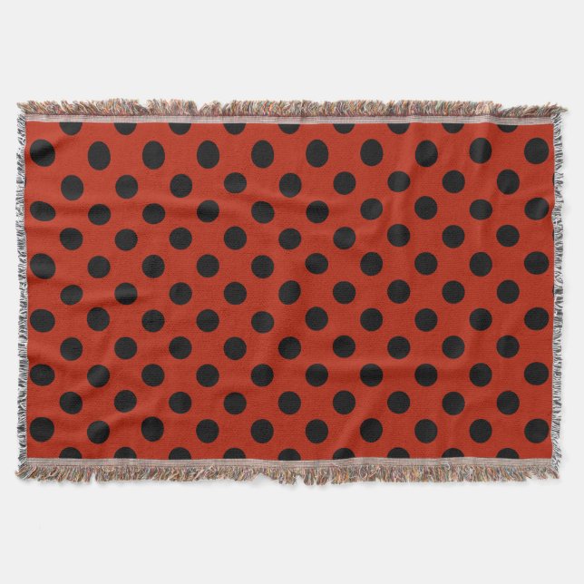 Black polka dots on red throw blanket (Front)