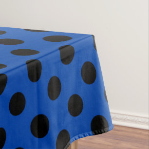 Black polka dots on royal blue tablecloth