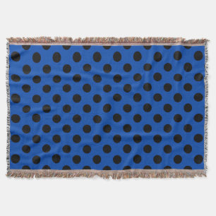 Black polka dots on royal blue throw blanket