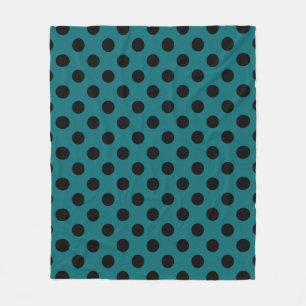 Black polka dots on teal fleece blanket