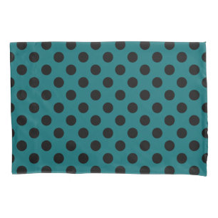 Black polka dots on teal pillowcase