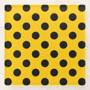 Black polka dots on yellow glass coaster