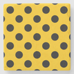 Black polka dots on yellow stone coaster