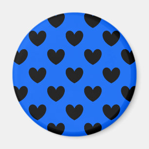 Black polka hearts on blue magnet