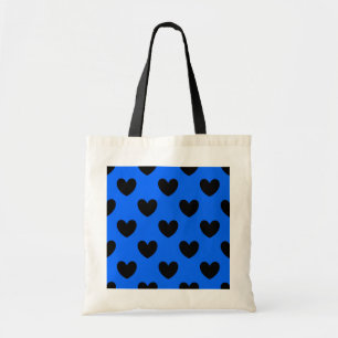 Black polka hearts on blue tote bag